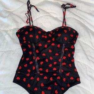 Madida black bodysuit with red hearts